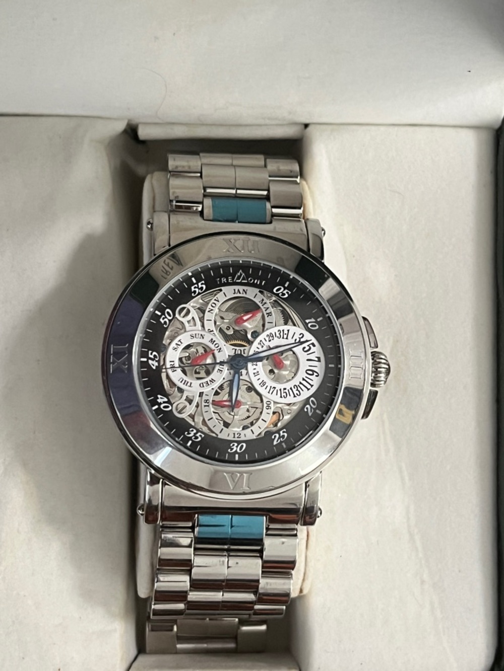 Tremont Automatic Skeleton
Roman Numeral Stainless Steel
watch 30m Day/Date Box